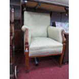 An Edwardian Inlaid Mahogany Easy Chair, with batwing cartouches to hand rests, tapering legs, re-