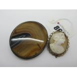 A Victorian Oval Hardstone Panel Brooch, collet set; an oval shell carved cameo brooch depicting