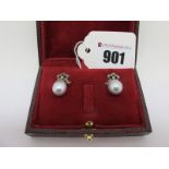 A Pair of Early XX Century Style Large Grey Pearl Earrings, each below diamond set stylised bow