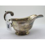 A Hllmarked Silver Sauce Boat, SB&S Ltd, Birmingham 1969, with leaf capped flying scroll handle.