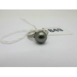 A Modern 9ct White Gold Black Pearl Dress Ring, (finger size O).