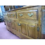 Oak Dresser, having three drawers over three cupboard doors, with open rack above, 152.5cm wide.