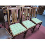 A Set of Four Early XX Century Oak Dining Chairs, with rail backs on square pad feet.