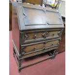 1920's Oak Bureau, in the Jacobean manner with fall front over two drawers, on barley twist legs.