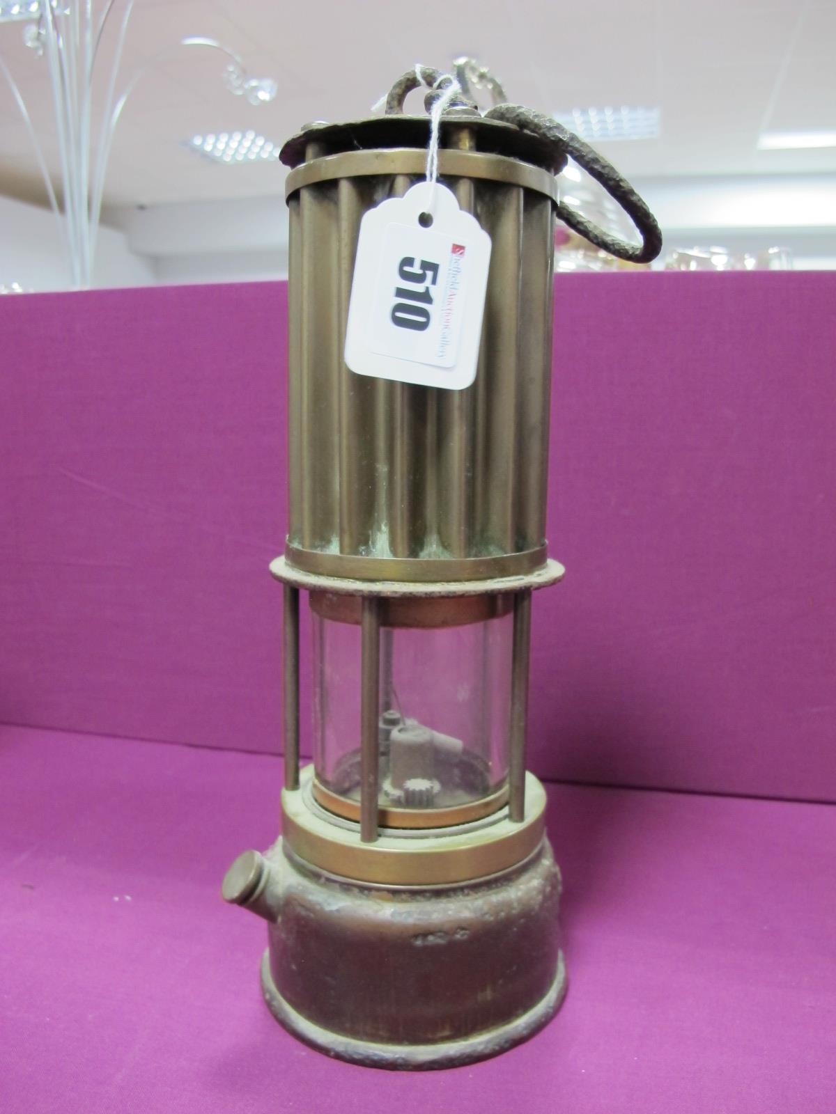 The Premier Lamp of Leeds Miners Lamp, having vertical ribbed upper body, 27cm high with