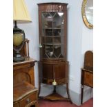 An Early XX Century Inlaid Mahogany Double Height Corner Cabinet, with cylinder front, glazed