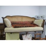 Early XX Century Mahogany Settee, with shaped back rail, carved scroll hand rests and shell motifs