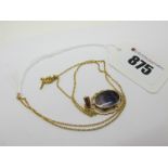 A Modern 9ct Gold Blue John Pendant, oval collet set, on a fine chain.