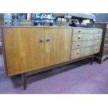 Teak Sideboard, circa 1970's, having aluminium ring and turned wooden handles to four graduated