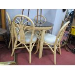 Cane Circular Topped Patio Table and Four Chairs. (5)