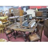 An Oak Draw Leaf Table, with Gothic, turned and block supports united by 'X' stretcher and a set