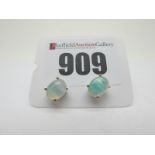 A Pair of Modern Single Stone Opal Earstuds, each oval cabochon four claw set, stamped "925".