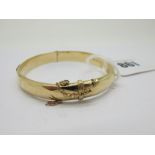 A 9ct Gold Hollow Bangle, hinged to snap clasp (internal diameter 5.5cm) (dents/damages) (9grams).