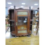 An Early XX Century Oak Smokers Wall Cabinet, with glazed door and brass finials, concealing two