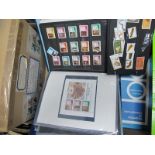 A Collection of Mint and Used World Stamps, mainly modern, in three albums and a small envelope.