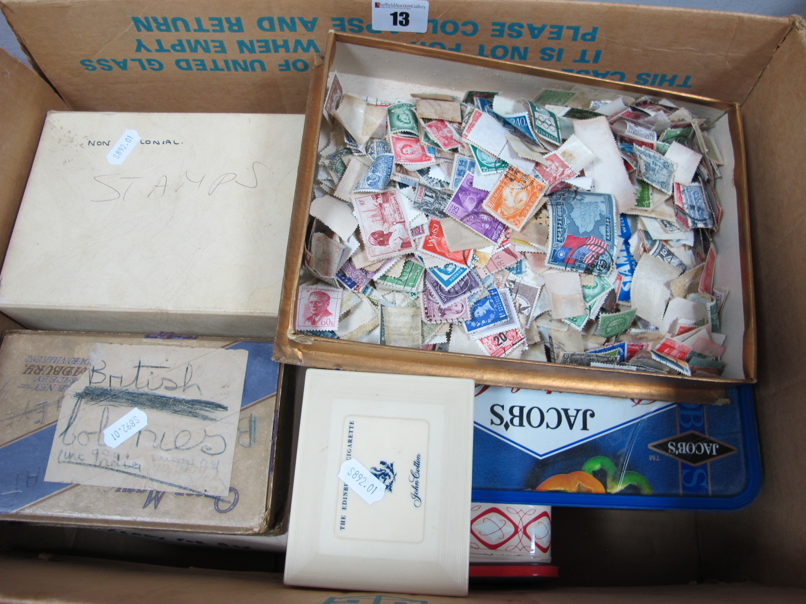 A Carton of Stamps, in small tins and boxes, all World including G.B, many thousands to sort.