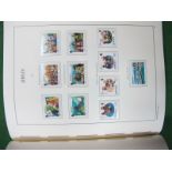 A Good Quality Lighthouse Hingeless Album, with mint stamps of Jersey from 1941 to 1999 virtually