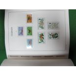 A Good Quality Lighthouse Hingeless Album, with mint Guernsey stamps and miniature sheets from