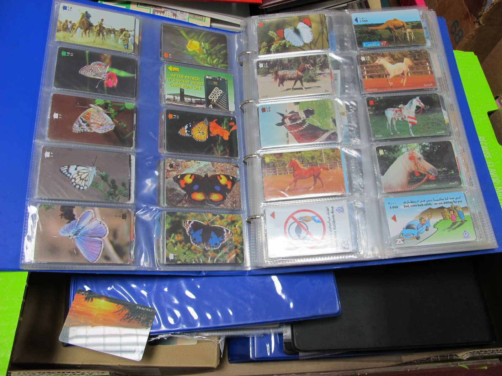 An Interesting Collection of Phone Cards, in four ring binder albums and loose in a box, to