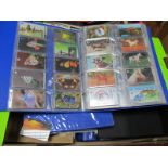 An Interesting Collection of Phone Cards, in four ring binder albums and loose in a box, to