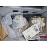 An Accumulation of GB and Foreign Stamps, used on and off paper in two boxes and bags, plus a