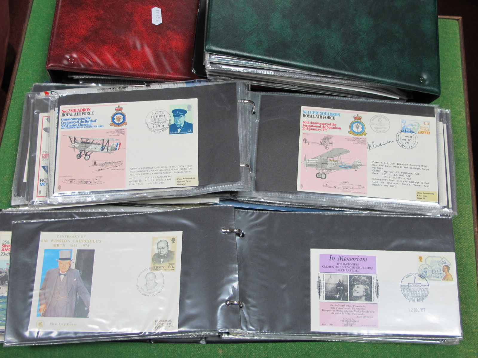WITHDRAWN. Four FDC Cover Albums Housing a Collection of Military Related FDC's, PHQ cards, plus.