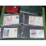 WITHDRAWN. Four FDC Cover Albums Housing a Collection of Military Related FDC's, PHQ cards, plus.