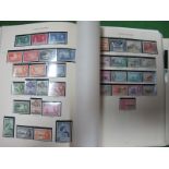 A Mint KGVI Collection, in a well filled album with many full sets and values to £1. Many Silver