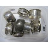 Eight Assorted Hallmarked Silver Napkin Rings, (various makers and dates) including foliate