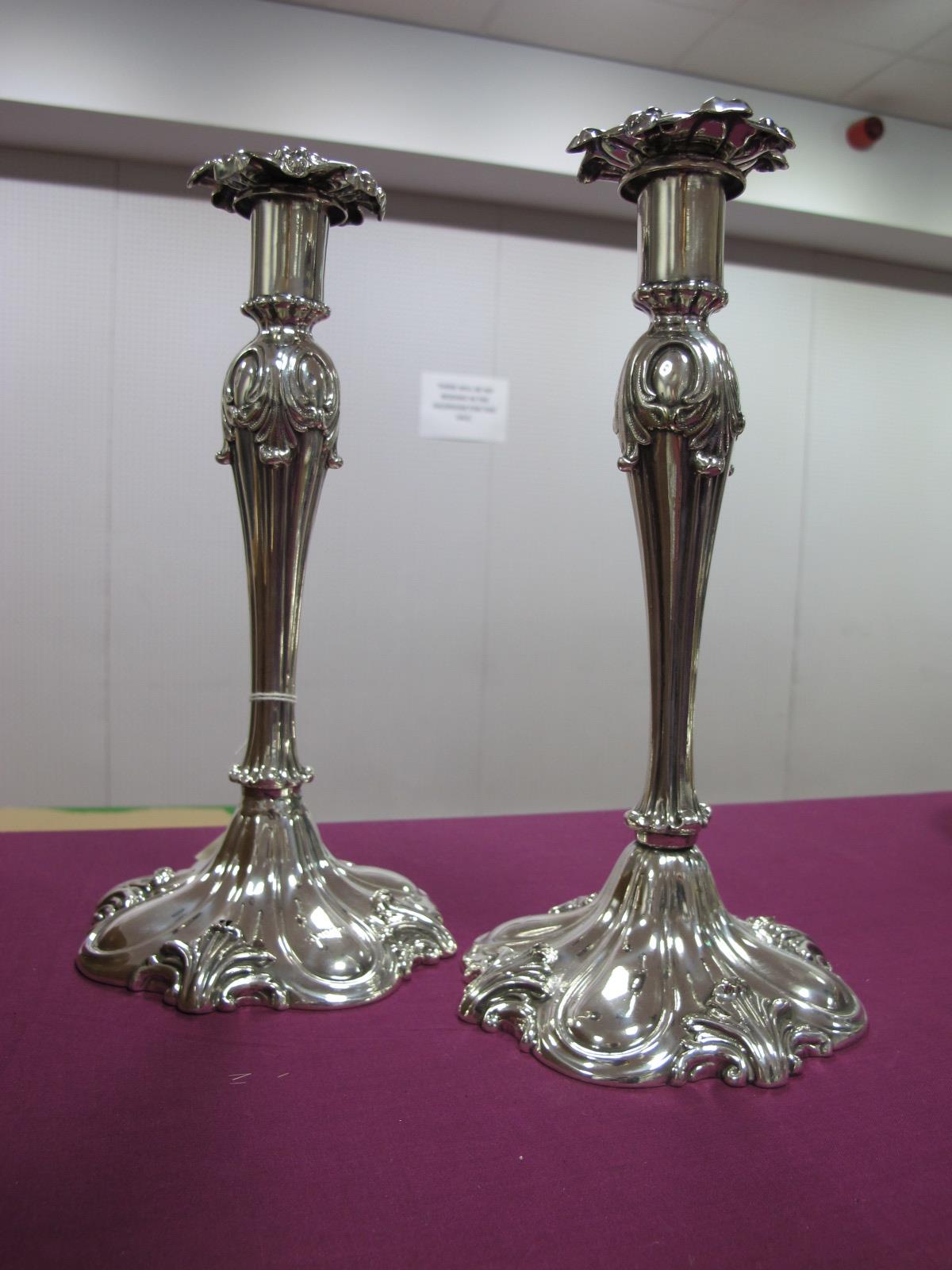 A Pair of Decorative Continental Style Plated Candlesticks, each of sinuous design, with removable