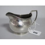 A Hallmarked Silver Cream Jug, (markers mark indistinct) London 1806, with foliate band, reeded