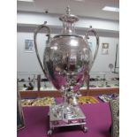 A Decorative XIX Century Plated Twin Handled Tear Urn, of trophy style allover decorated, with