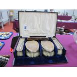 A Cased Set of Four Hallmarked Silver Backed Brushes, SB, Birmingham 1926, complete with matched