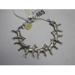 An Unusual Dog Link Charm Style Bracelet, each link stamped "Silver", to silver hallmarked heart
