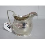 A Hallmarked Silver Cream Jug, (marks rubbed) with price dot details and reeded edge and angular