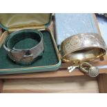 A Hallmarked Silver Vintage Style Bangle, with textured buckle detail; together with another bangle,