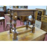 An Oak Coffin Style Stool, with rectangular top on turned and block supports 45.5cm wide.