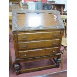 1920's Oak Bureau, with pokerwork floral carved border to fall front, over three drawers on cup