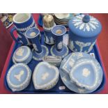 Wedgwood Dark Blue Jasper Ware, biscuit barrel, candlesticks (damaged), hot water jug, sugar caster,