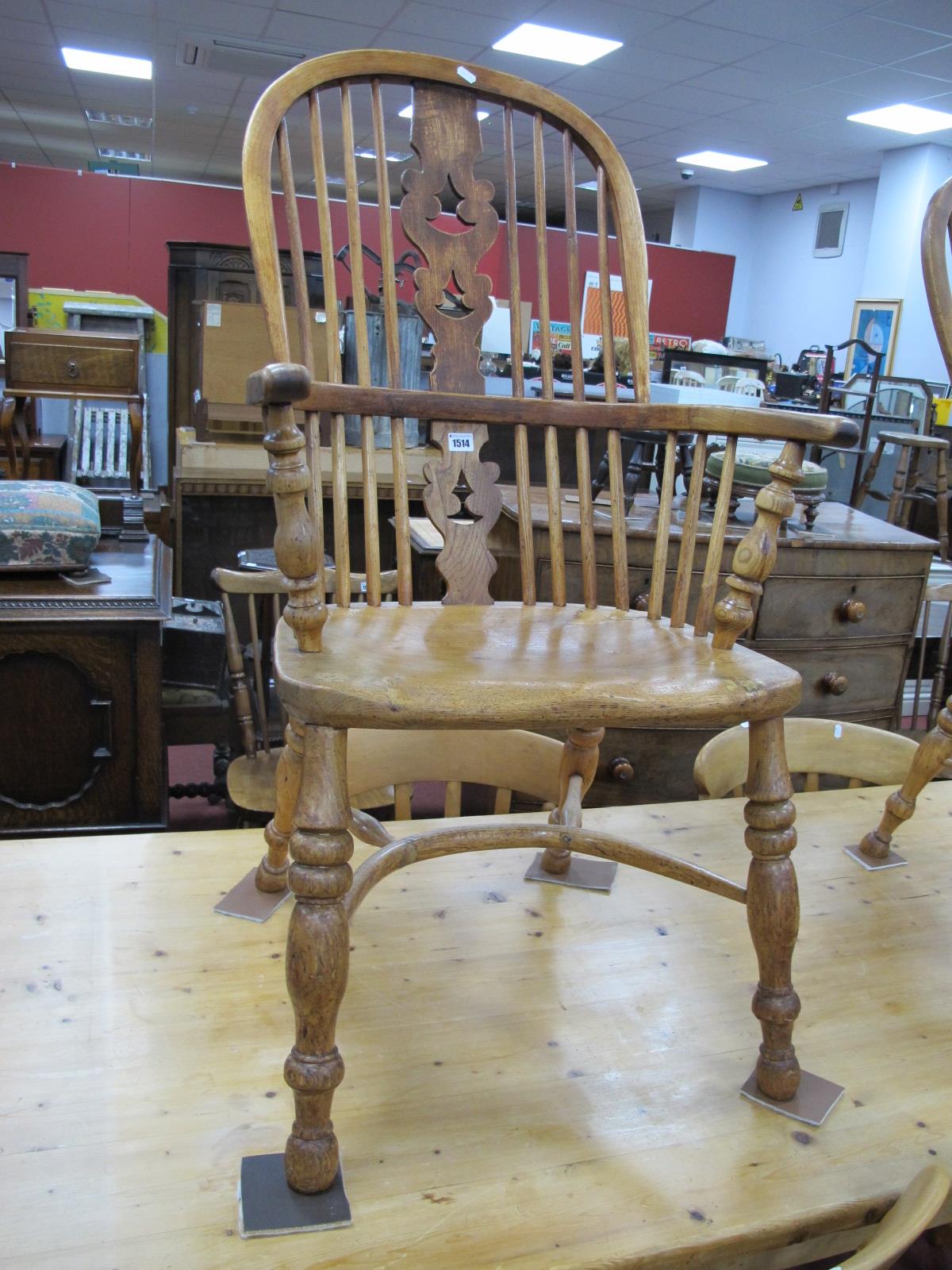 A XIX Century Ash and Elm Windsor Armchair, with spindle back, pierced central splat, dish seat,