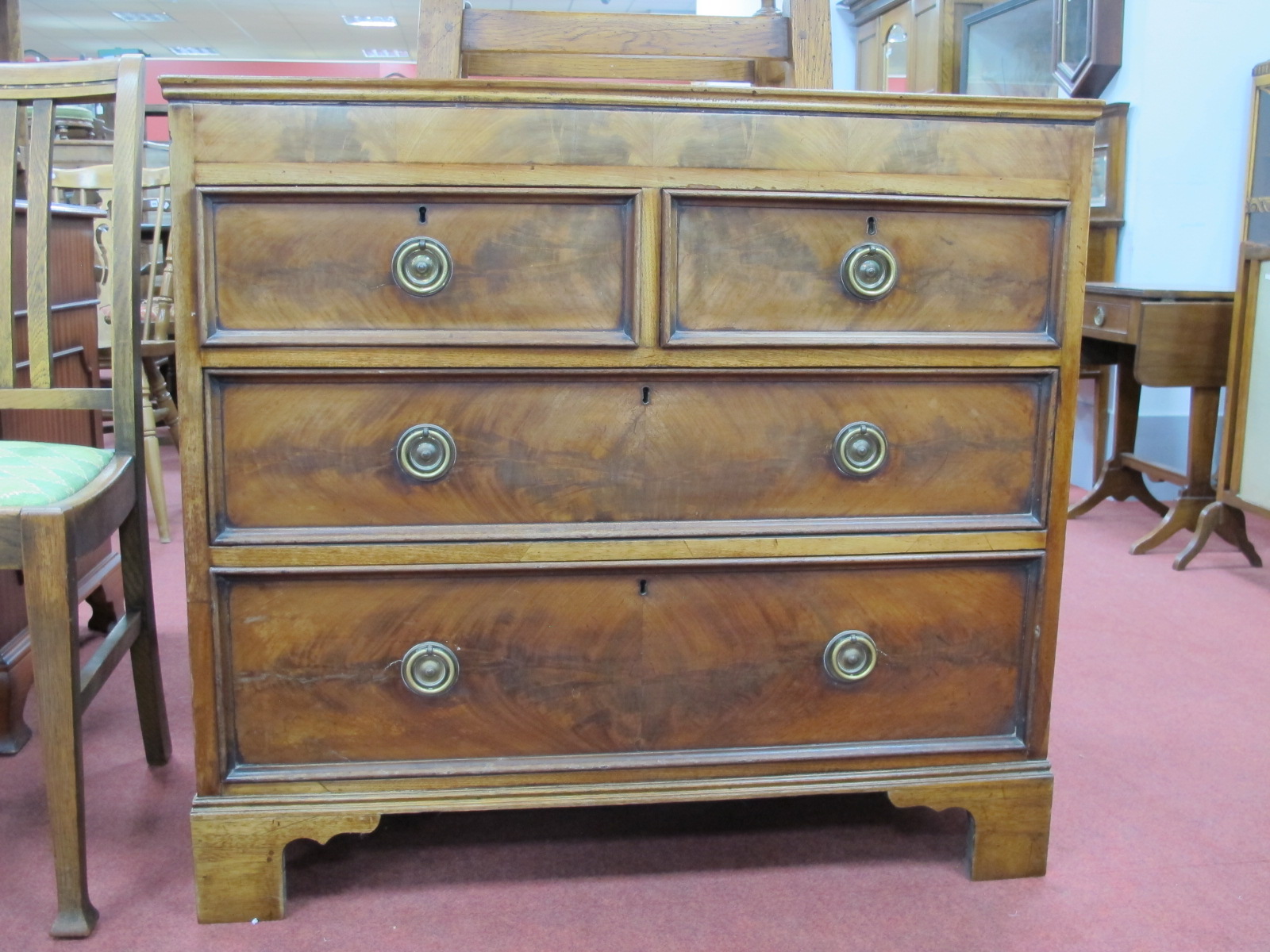 A XIX Century Mahogany Straight Front Chest of Two Short and Two Long Drawers, having brass ring