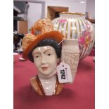 A Peggy Davies Charlotte Rhead Character Jug, 16.5cm high.