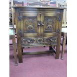 Bevan Funnell Reproduction Oak Cabinet, with carved cupboard doors and drawer, 68.5cm wide.
