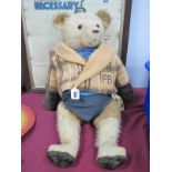 A Gold Plush Teddy Bear, with growling noise, articulated limbs stitched nose, hands and feet,
