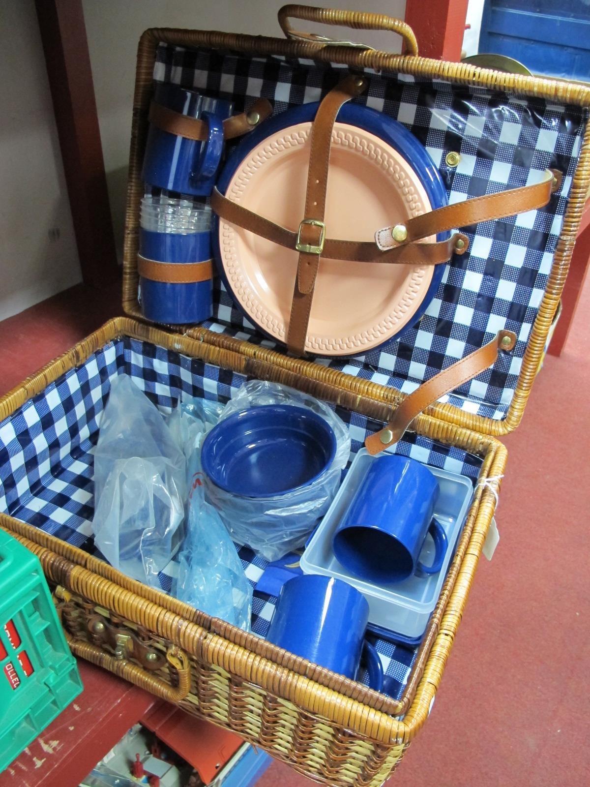 A Wicker Picnic Hamper, with plastic mugs, plates etc.