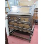 1920's Oak Bureau, in the Jacobean manner with fall front over two drawers, on barley twist legs.