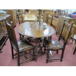 A 1920's Oak Gateleg Dining Table, with barley twist supports, four matching chairs. (5)