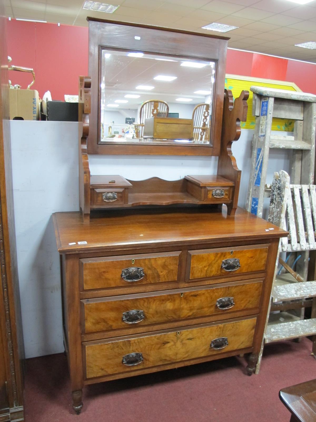 A XIX Century Walnut Dressing Table, with central and swing side mirrors over two short ad two