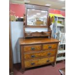 A XIX Century Walnut Dressing Table, with central and swing side mirrors over two short ad two