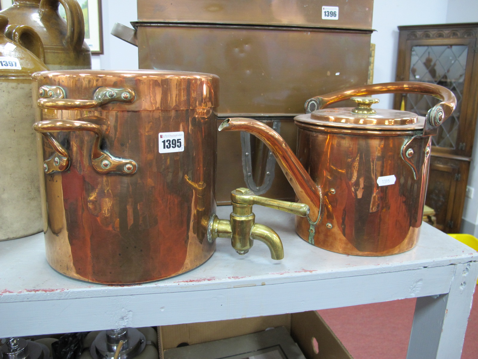 A XIX Century Copper Tea Dispenser, with a brass tap, together with a XIX Century copper kettle. (